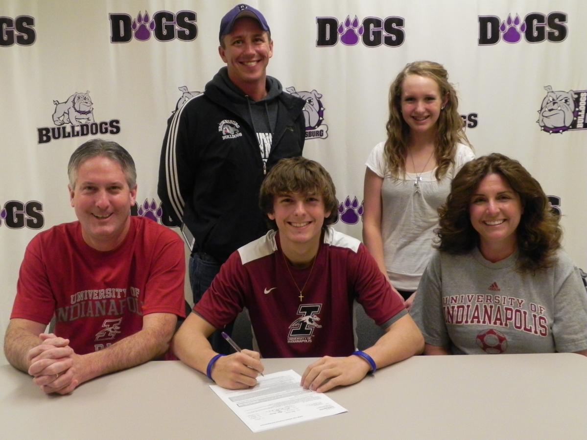 Sitting – Bryan Hiquet (father), JT (signing letter) and Stacy Hiquet (mother)
Standing – Todd Frost (BHS Head Coach), and Shelby Hiquet (sister)