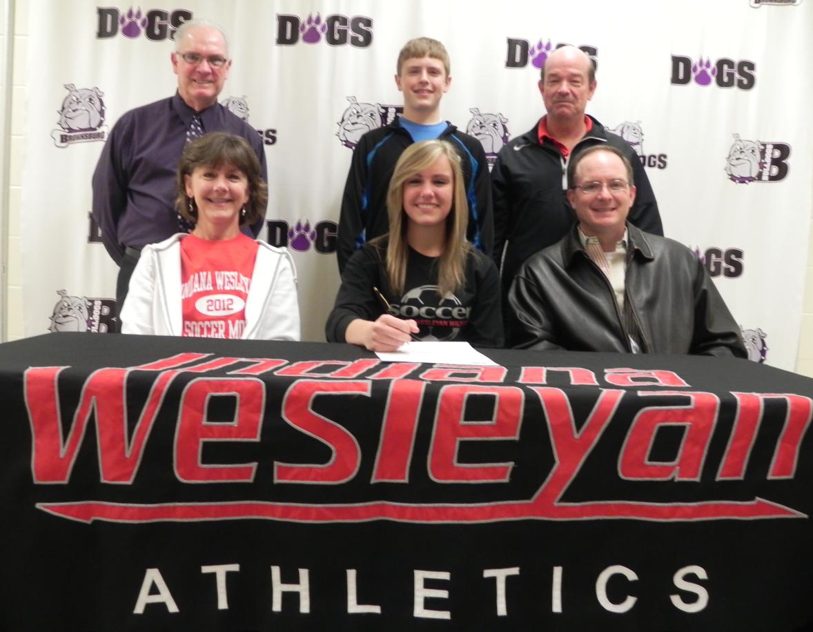 Pictured left to right:

Sitting – Marcie Devney (mother), Kerry, signing Letter of Intent, Alan Devney (father)
Standing – Phil Slavens (BHS Head Coach), Noah (brother) and John Bratcher (IWU Head Coach)